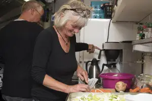 Morgenster cook preparing vegetables in the galley