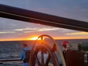 Sunset seen from Tall Ship Morgenster during a Hanse Sail sailing trip